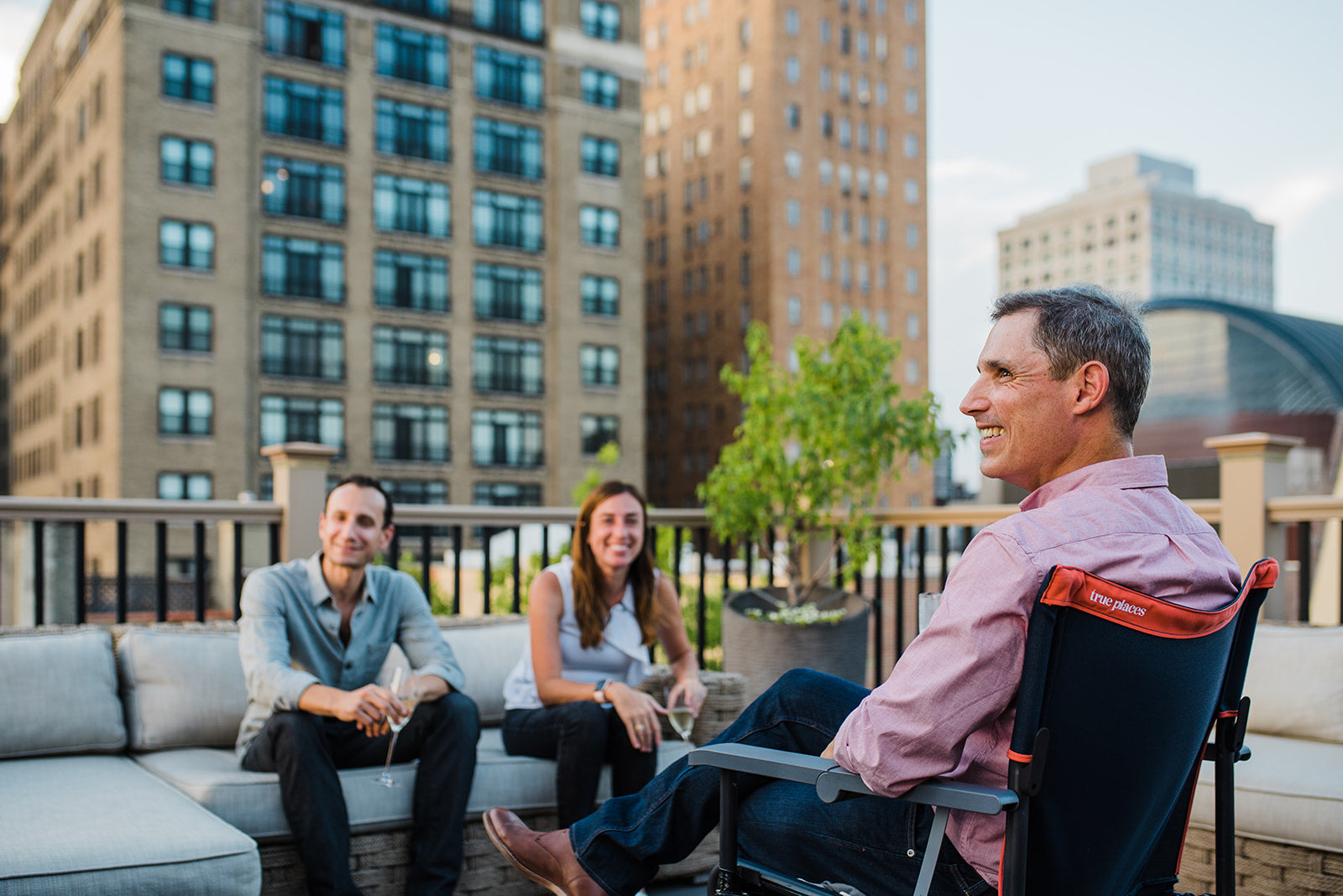 True Places Emmett Portable Chair on roofdeck with friends. Best deck chair instead of using old camping chairs.