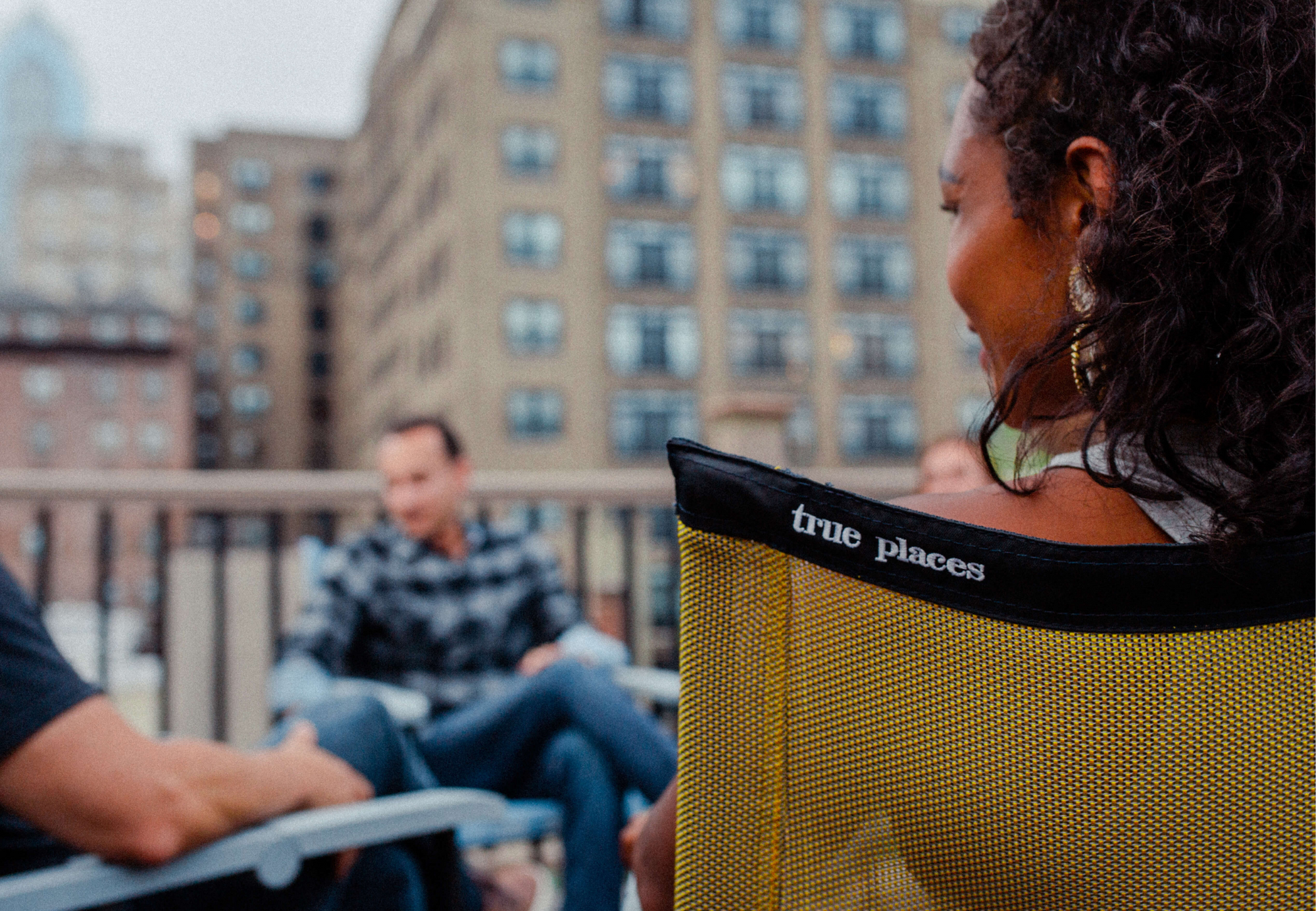 True Places Emmett Folding Chair Sitting Comfortably on a Modern Rooftop instead of using a camping chair