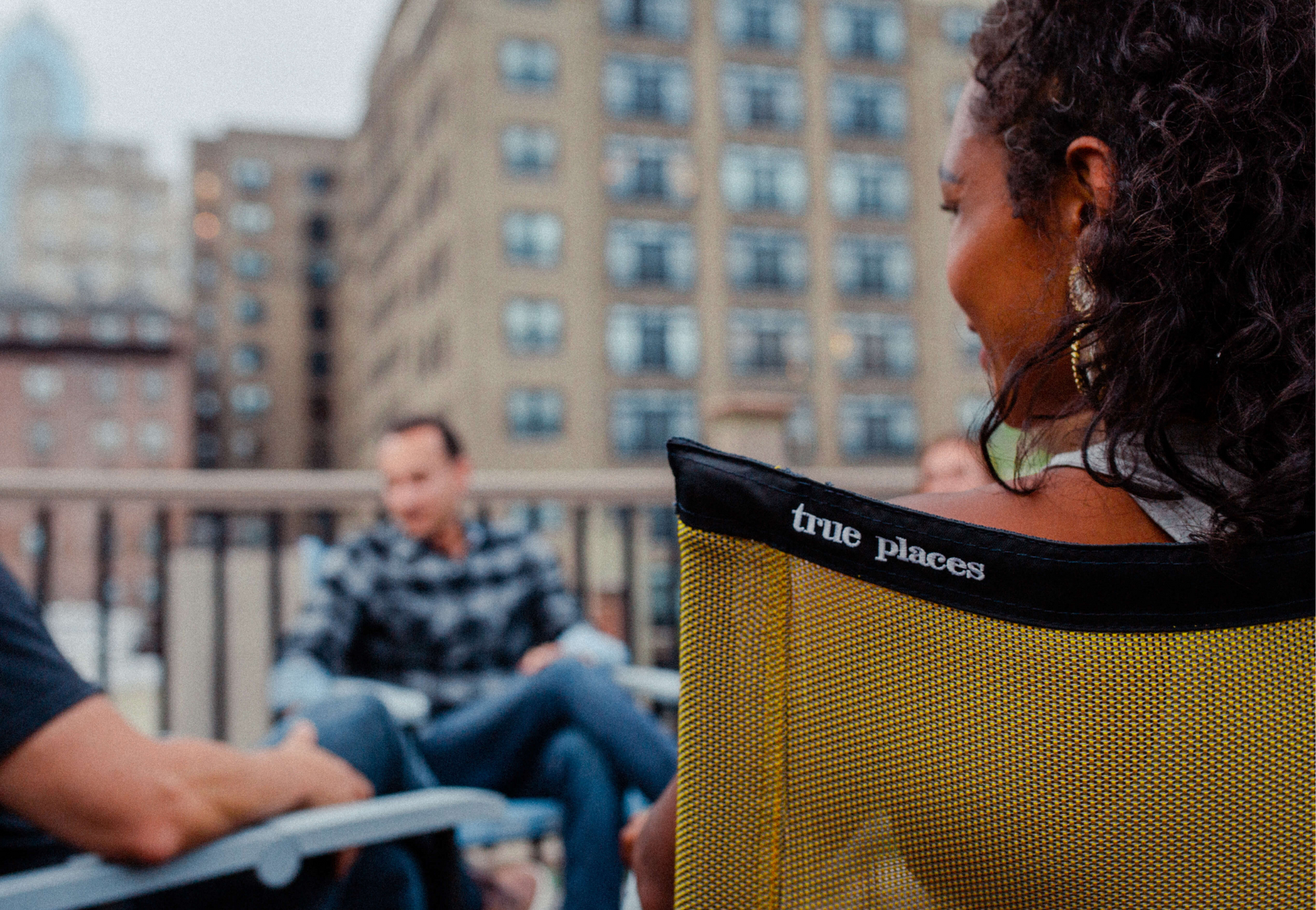 True Places Emmett Folding Chair Sitting Comfortably on a Modern Rooftop instead of using a camping chair 