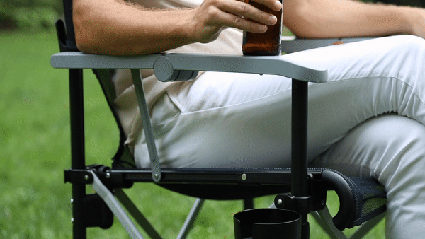 Bottle openers under each arm of the True Places Emmett Portable Chair. Other thoughtful features include cupholder and phone holder accessories that can be moved to the right or left, hooks on the back for bags and large feet for stability on any surface.